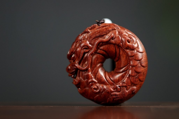 圆龙紫檀手把件