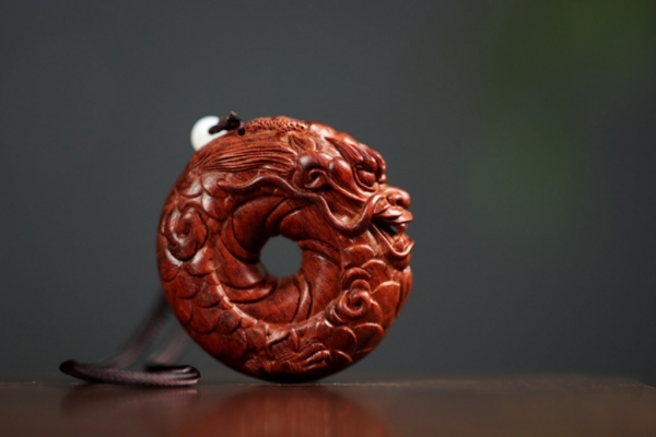 圆龙紫檀手把件